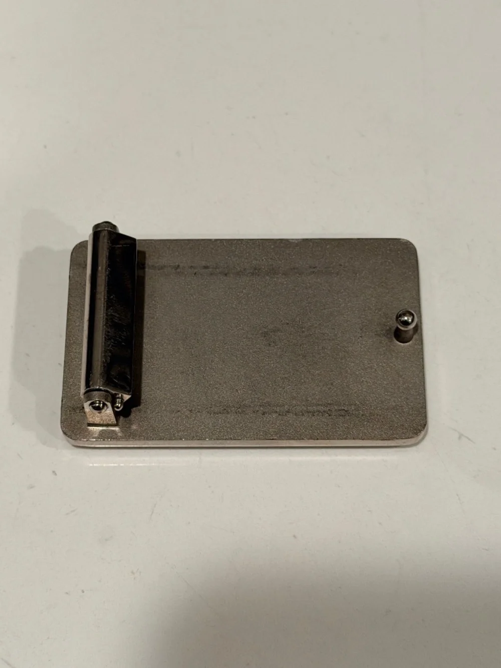 2 Luis Vuitton belt buckles